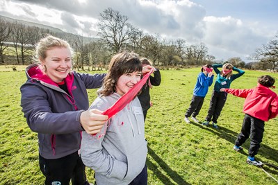 Youngsters from Gwynedd schools were at Glanllyn today and completed team building and initiative tests. Awen Williams, 14 from Blaenau Ffestiniog with instructor Elen Evans at the blindfold event
