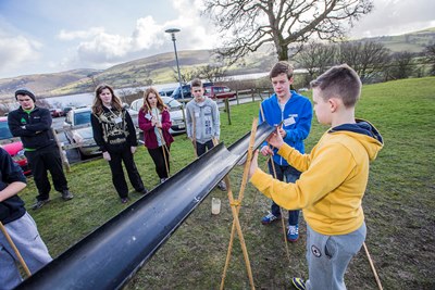 Youngsters from Gwynedd schools were at Glanllyn today and completed team building and initiative tests. Aled Ellis, 13 from Blaenau Ffestiniog ponders one of the tasks with some help from Andrew Thomas, 14 from Porthmadog