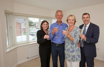 MacBryde Homes in Llandudno Juncition celebrate the completion of the development with a glass of champagne. Pictured: AM Janet Finch-Saunders along with Geoff and Hilary Leyland who have just purchased one of the homes along with Simon MacBryde - Managing Director of MacBryde Homes