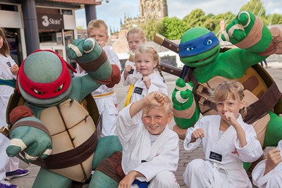 Teenage Mutant Ninja Turtles visit Eagles meadow Wrexham. Pictured are Turtles Leo and Raph with members of Hope Wrexham Tae Kwon-do (TKD) Club .