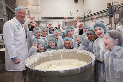 VILLAGE BAKERY, WREXHAM. Pupils from Wood Memorial CP school, Saltney during a visit to the Village Bakery, Wrexham. Photographed is Robin Jones with pupils uring the tour.